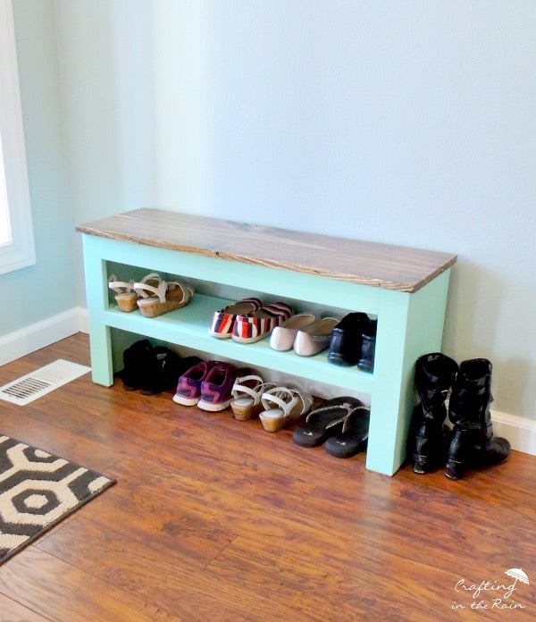 teal painted wooden bench with shoe storage rack