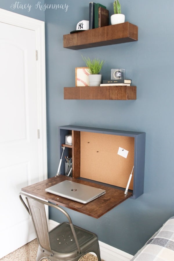 DIY fold-down wall desk with floating shelves creating a compact home office nook