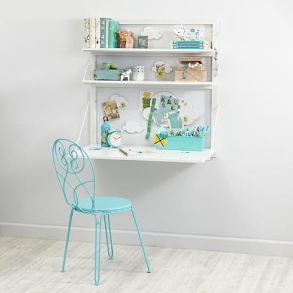 Murphy-style fold-down desk with hidden storage creating a space-saving home office