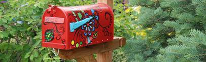 painted mailbox for decorative garden tool storage