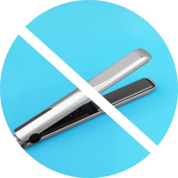 photo of flat iron on blue background with line through it