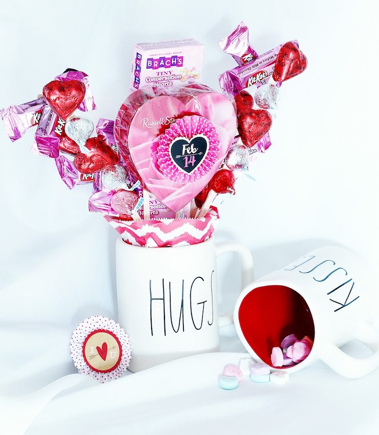 Valentine themed mug with pink and red candy arrangement inside