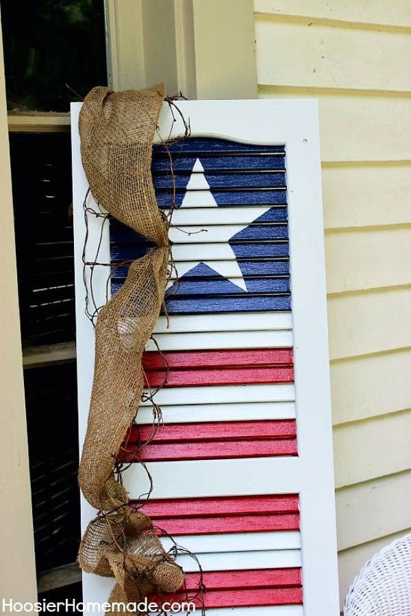 Painted wooden shutter that resembles American Flag
