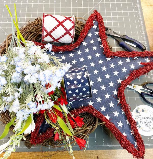 4th of July themed wreath with flowers and blue stars