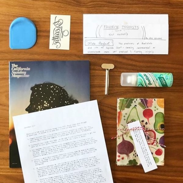 assortment of "favorite things" including magazine, handwritten notes, small gifts, and personal keepsakes