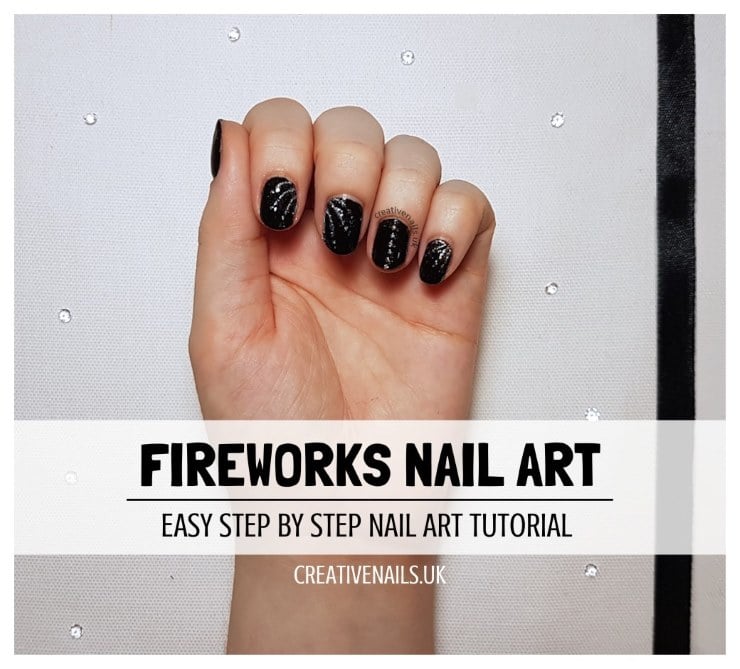 Black glitter firework nail art with sparkly silver accents on short nails